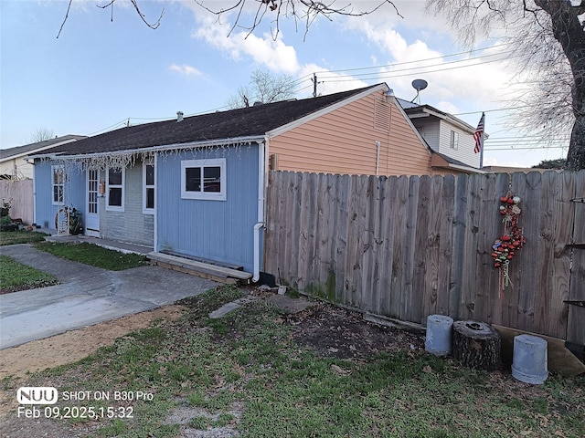 view of side of property with fence