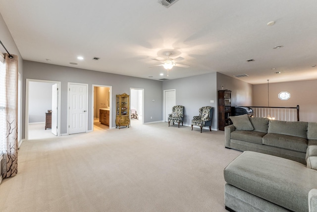 living area featuring recessed lighting, visible vents, light carpet, ceiling fan, and baseboards