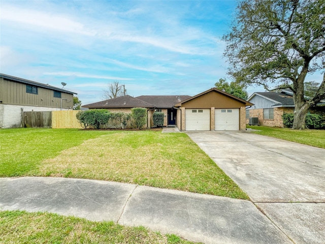 view of front of property with a garage, brick siding, fence, driveway, and a front yard