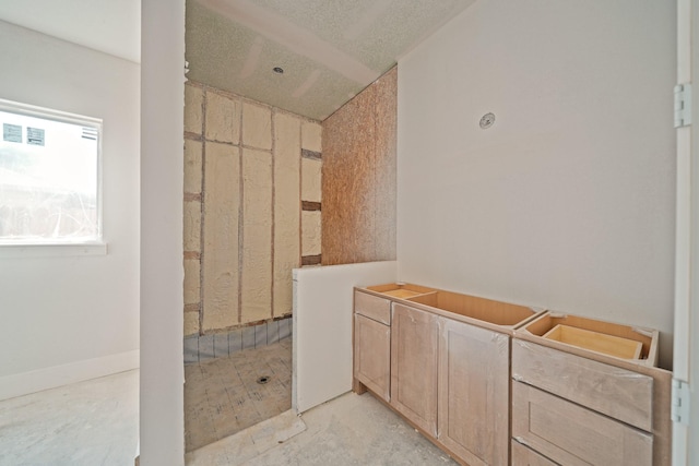 bathroom featuring concrete floors