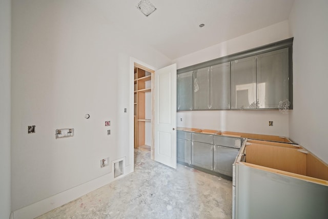 kitchen featuring gray cabinets and unfinished concrete floors