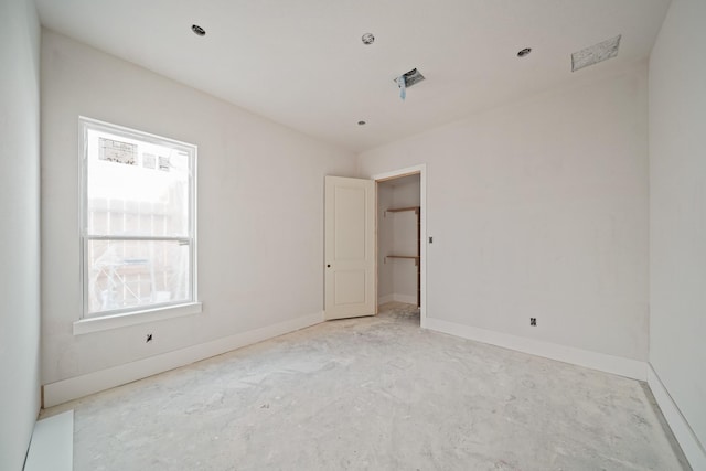 spare room with baseboards