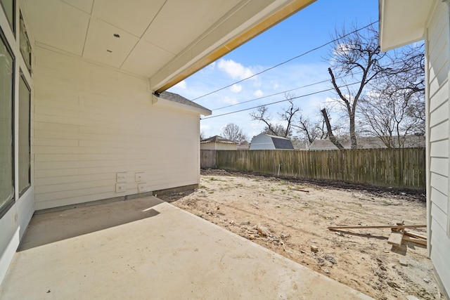 view of yard featuring a patio area and a fenced backyard