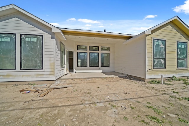 rear view of property featuring a patio