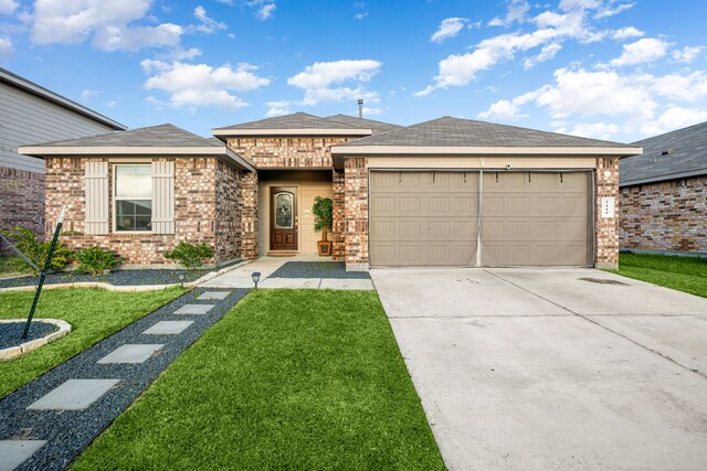 prairie-style home featuring a front yard, brick siding, driveway, and an attached garage