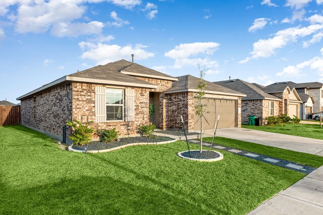 view of front of house featuring brick siding, concrete driveway, an attached garage, a front yard, and fence