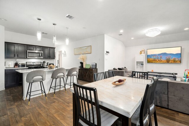 dining space with dark wood-style floors, recessed lighting, and visible vents