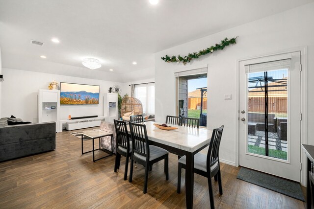 dining area featuring dark wood-type flooring, recessed lighting, and visible vents