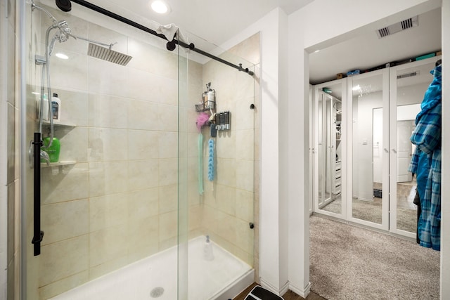 full bath featuring a stall shower and visible vents