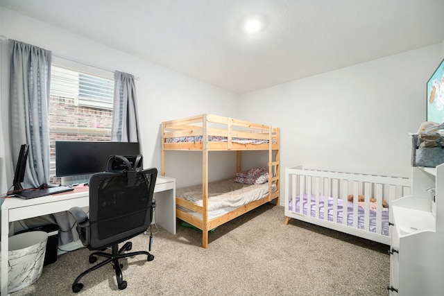 bedroom featuring light carpet