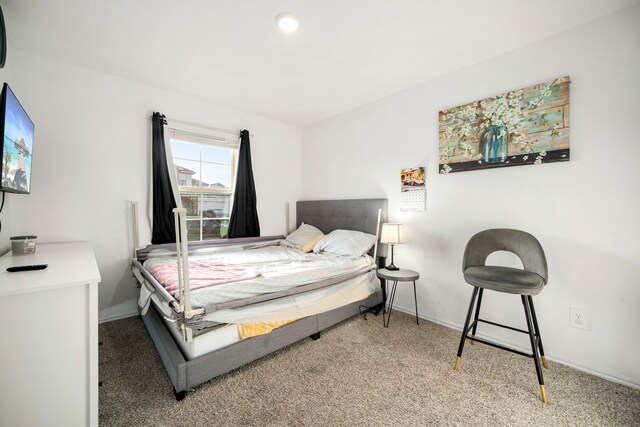 carpeted bedroom with baseboards