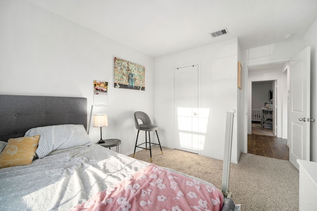 bedroom with carpet floors and visible vents