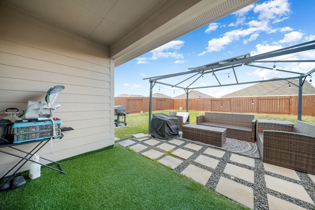 view of yard with a patio area, a fenced backyard, and an outdoor hangout area