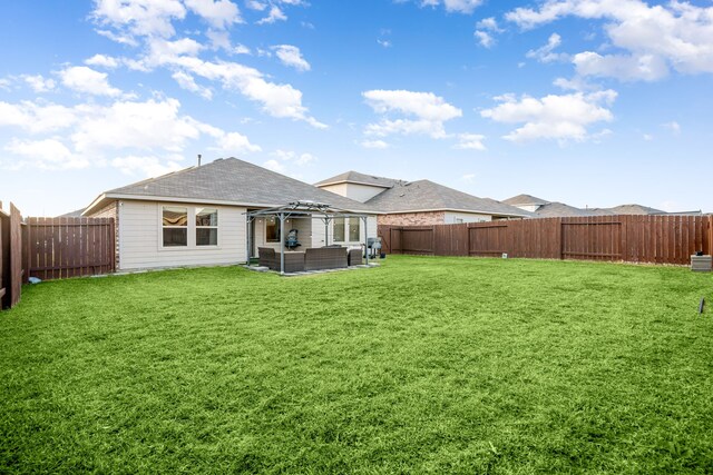 rear view of house with an outdoor hangout area, a gazebo, a lawn, and a fenced backyard