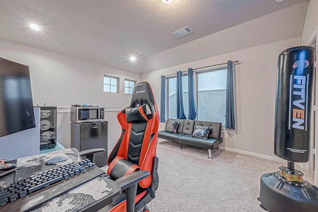 workout area with light carpet, recessed lighting, visible vents, and baseboards