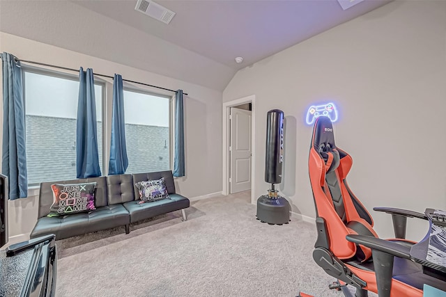 interior space with baseboards, visible vents, vaulted ceiling, and carpet flooring