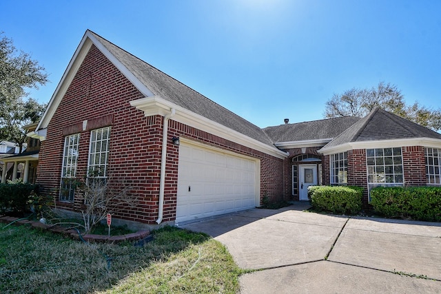 view of front of home featuring a garage, driveway, and brick siding