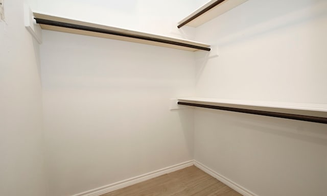 spacious closet with wood finished floors