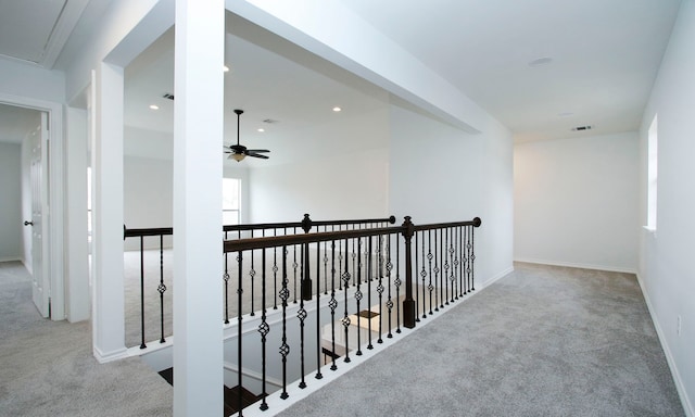 corridor with light carpet, attic access, visible vents, an upstairs landing, and recessed lighting