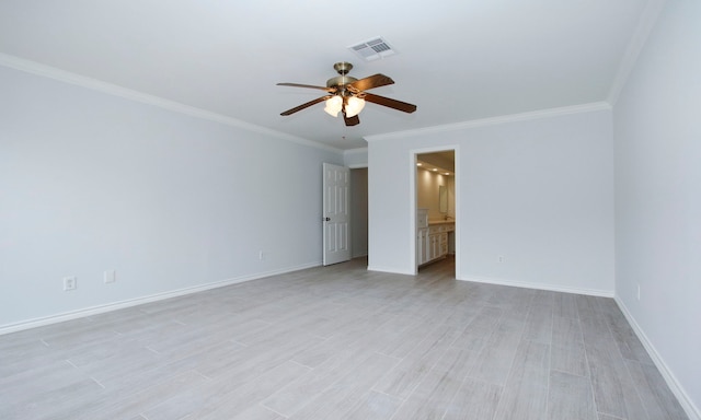 unfurnished bedroom featuring baseboards, visible vents, connected bathroom, crown molding, and light wood-type flooring