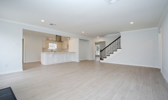 unfurnished living room featuring baseboards, stairway, visible vents, and light wood-style floors