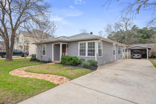 view of front of property featuring a carport, driveway, a front lawn, and a shingled roof