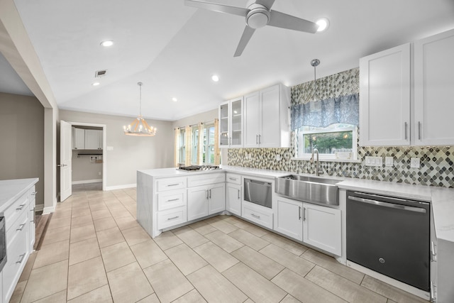 kitchen with dishwasher, glass insert cabinets, decorative light fixtures, light countertops, and white cabinetry