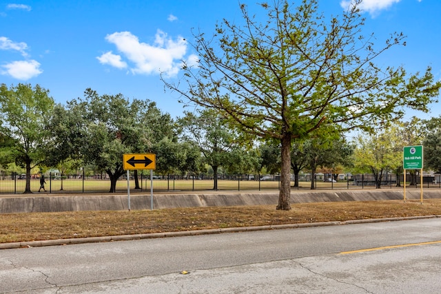 view of jungle gym featuring fence