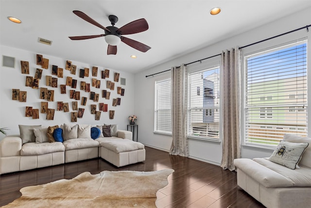 living room with ceiling fan, dark wood-style flooring, visible vents, and recessed lighting