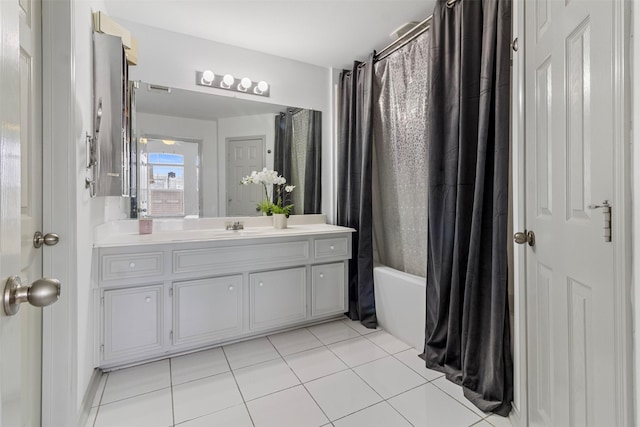 full bathroom with tile patterned flooring, vanity, and shower / bath combo