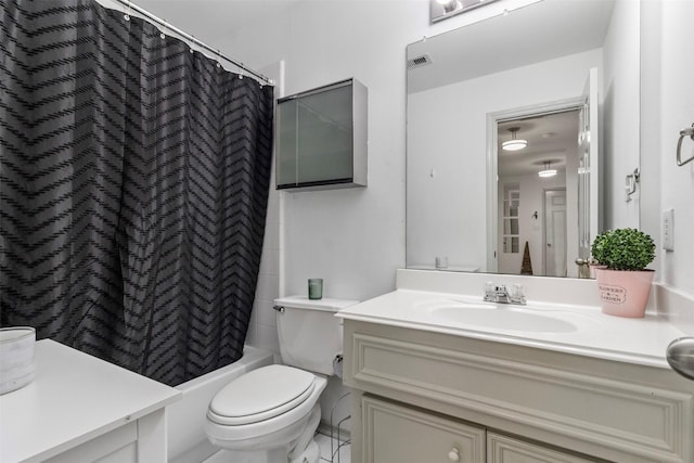 bathroom featuring toilet, shower / bath combo, and vanity