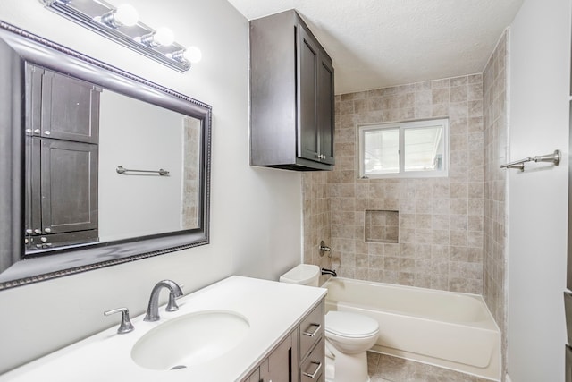 bathroom featuring shower / bath combination, toilet, tile patterned flooring, a textured ceiling, and vanity