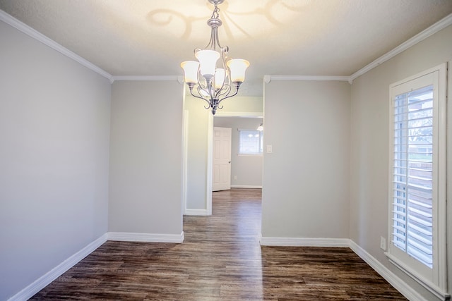 unfurnished dining area with dark wood-type flooring, a wealth of natural light, a notable chandelier, and baseboards