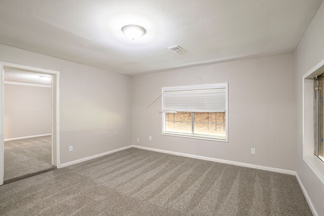 unfurnished bedroom with baseboards, visible vents, and carpet flooring
