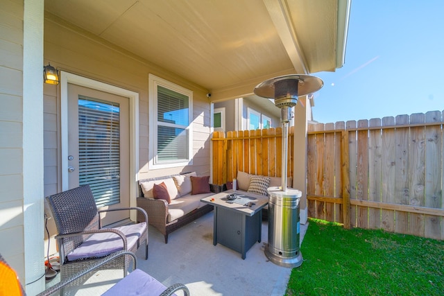 view of patio featuring fence and an outdoor hangout area