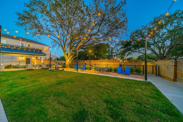 view of yard with a patio area and a fenced backyard