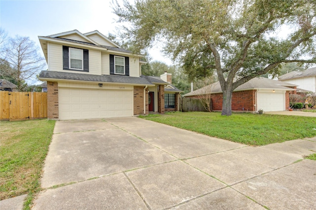 traditional-style home featuring a front yard, brick siding, fence, and driveway