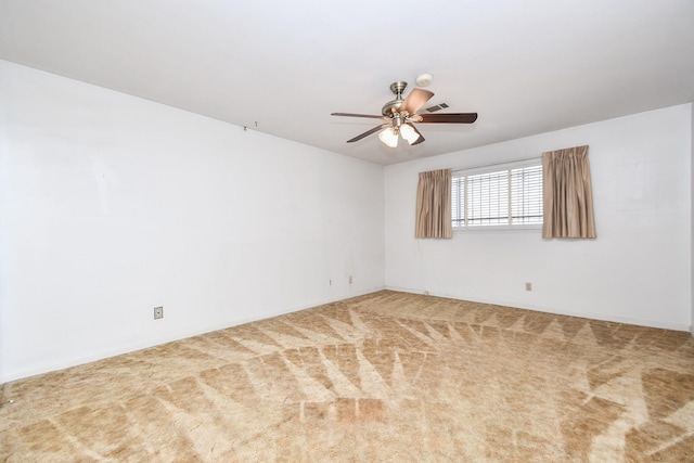 carpeted empty room with a ceiling fan and visible vents