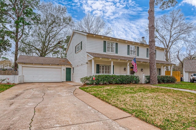 view of front of property featuring a garage, concrete driveway, fence, a front lawn, and brick siding