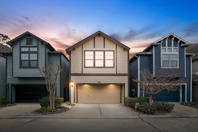 view of front of property featuring driveway and an attached garage