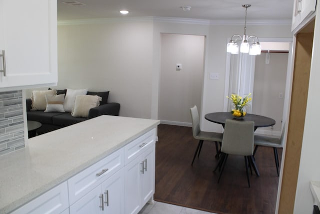 dining space with ornamental molding, recessed lighting, baseboards, and wood finished floors