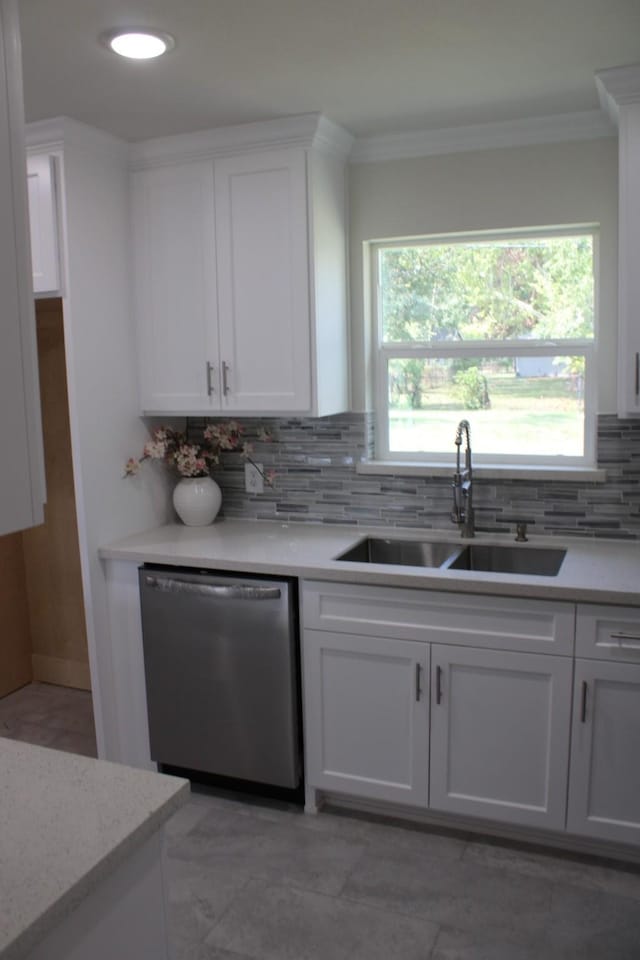 kitchen with white cabinetry, dishwasher, and a sink