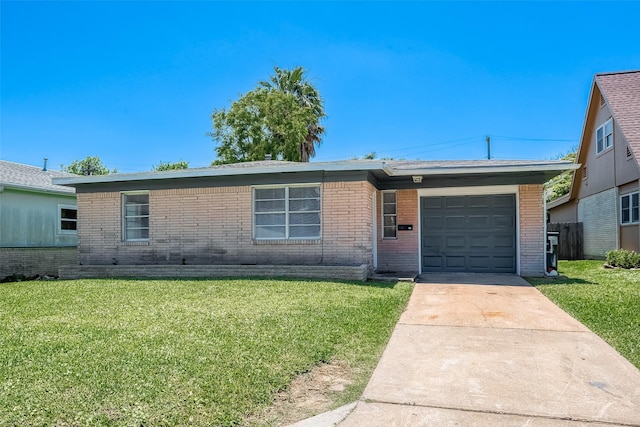 ranch-style house with an attached garage, driveway, brick siding, and a front yard