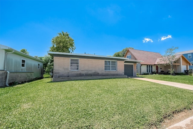 ranch-style house featuring an attached garage, concrete driveway, brick siding, and a front yard