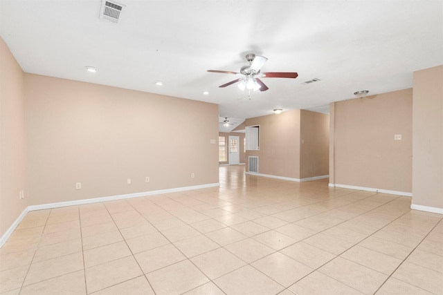 spare room with visible vents, ceiling fan, and light tile patterned floors