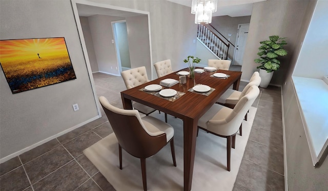 dining space with an inviting chandelier, dark tile patterned floors, stairway, and baseboards