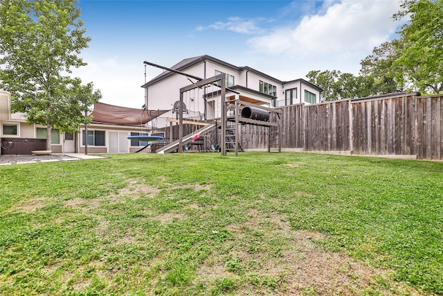 view of yard with a playground and fence