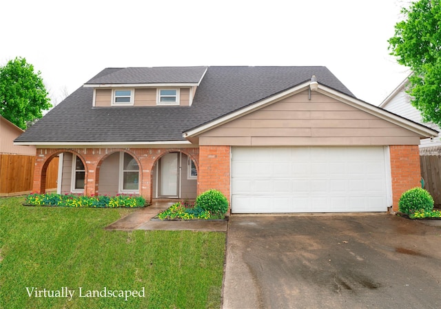 view of front of home featuring driveway, fence, and brick siding