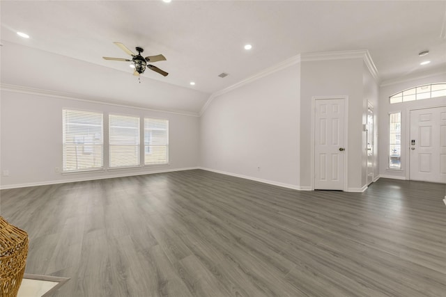 unfurnished living room featuring dark wood-style flooring, lofted ceiling, ornamental molding, a ceiling fan, and baseboards