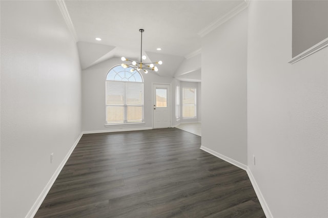 interior space featuring baseboards, dark wood-style flooring, an inviting chandelier, and crown molding